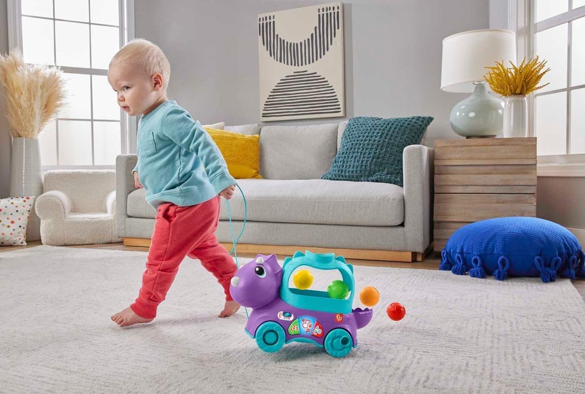 Fisher-Price de aprendizagem infantil e infantil, brinquedo de puxar bola de dinossauro com estágios inteligentes, versão em inglês do Reino Unido, Triceratops Poppin, HNR50