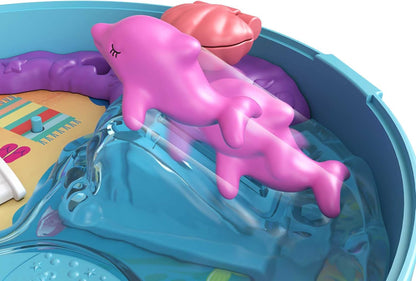 Polly Pocket Dolphin Beach Compact, tema de aventura na praia com boneca Micro Polly e sereia, 5 revelações e 12 acessórios, recurso pop e swap, ótimo presente para maiores de 4 anos, GTN20