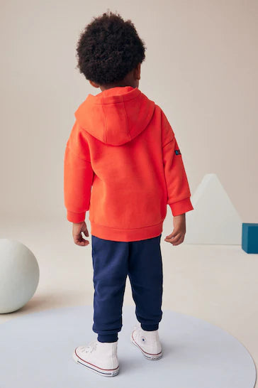 |Niño| Conjunto de sudadera y joggers con emblema de personaje en rojo/azul marino (3 meses a 7 años)